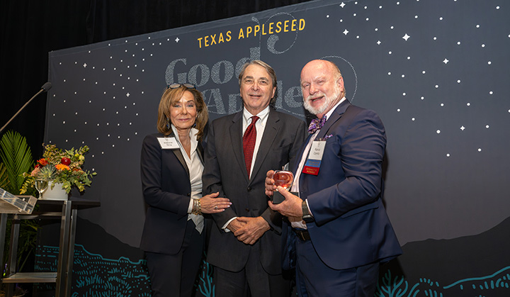 Melanie Gray and Mark Wawro receive the 2023 J. Chrys Dougherty Good Apple Award on November 15, 2023, presented by President of the Texas Appleseed Board of Directors, Patrick Cantilo.
