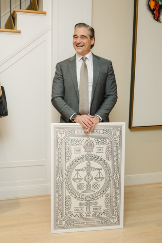 Man smiling with a poster