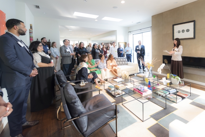People attending Texas Appleseed's 30th birthday party in Dallas